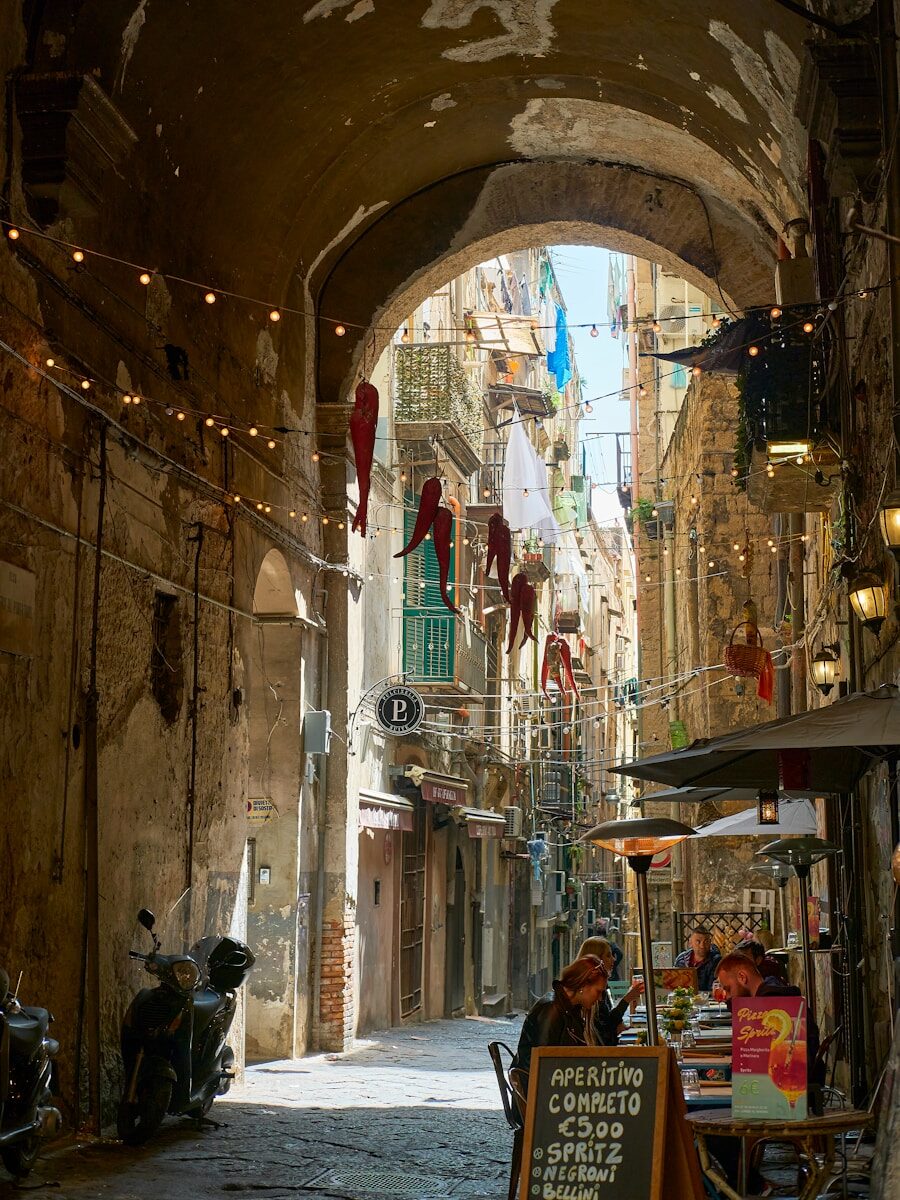 a narrow alleyway with shops